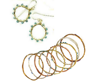 Set of gold hoop earrings and bracelets with beaded accents on a white background