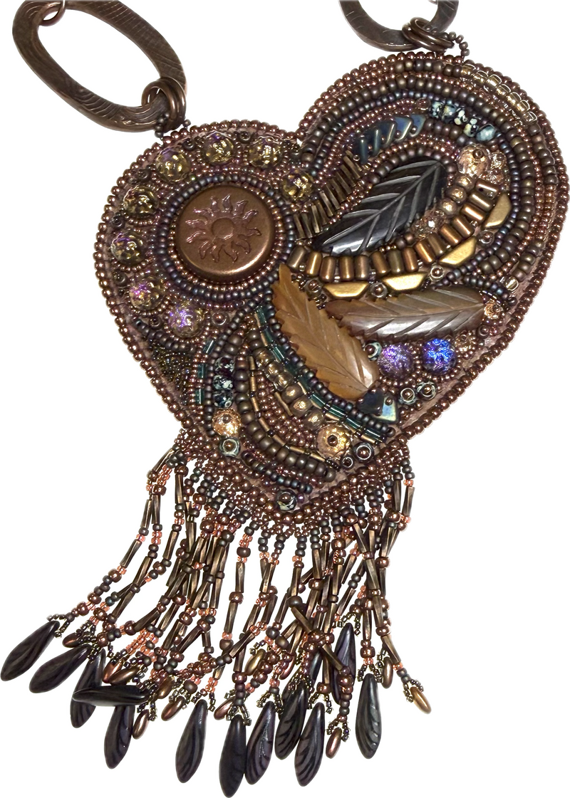 An ornate heart-shaped beaded pendant necklace with dangling bead fringe, featuring metallic bronze, gold, brown, and black beads, feather motifs, and iridescent accents.